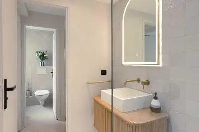 a bathroom with a sink and a toilet at Maya Cannes in Cannes