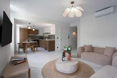 a living room with a couch and a table at Maya Cannes in Cannes