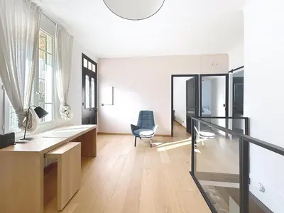 a living room with a desk and a chair at Maison Noble in Cannes
