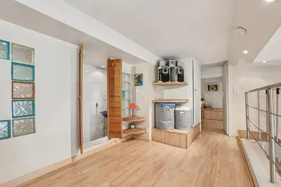 a living room with a staircase and a room with at Cosy Short-Term Rental in Cannes in Cannes