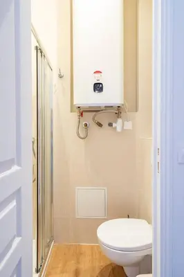 a small bathroom with a toilet and a sink at TINY HOUSE en duplex avec terrasse in Cannes