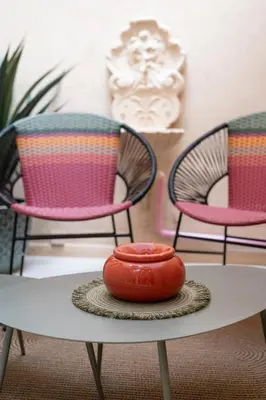 a table with three chairs and a hot dog on it at Esprit Chic - Elégant & central près du Palais in Cannes