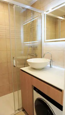 a bathroom with a sink and a washing machine at Proche gare et commerces, 5min plage, 4 personnes - Palmazur Vacances in Cannes
