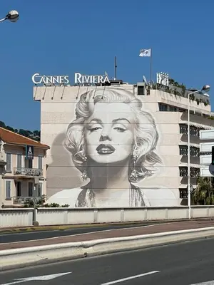 a mural of a woman on the side of a building at Magnifique studio proche palais des festivals in Cannes