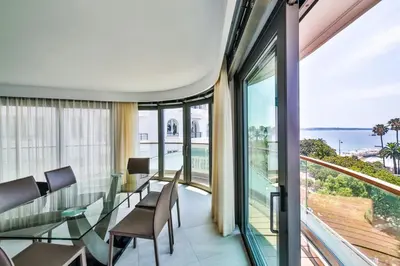 a dining room with a view of the ocean at 7 Croisette in Cannes