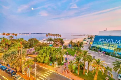 an aerial view of a city with palm trees and the ocean at 7 Croisette in Cannes