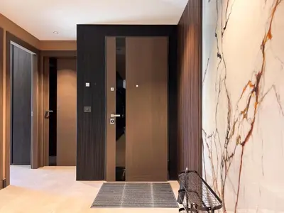 a hallway with a black door and a mirror at Croisette Luxury in Cannes