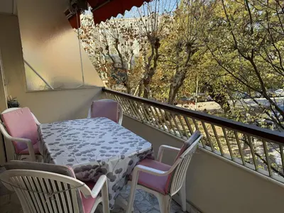 a table and chairs on a balcony with a view at Central Studio in Cannes Near The Martinez - 2351 in Cannes