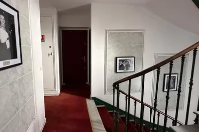 a hallway with a staircase and a door with a stair case at Studio near Palais des Festivals in Cannes