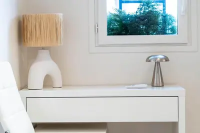 a white refrigerator with a remote control on top of it at Le Paradis Hoche - City centre - Terrace - Quiet - AC in Cannes