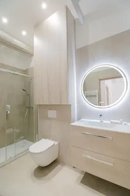 a bathroom with a toilet and a sink and a mirror at La Mouette-appartement au Vieux Port in Cannes