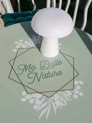 a table with a white lamp on top of it at La Mouette-appartement au Vieux Port in Cannes