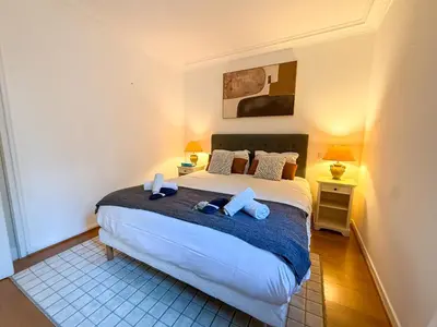 a white kitchen with white appliances and white cabinets at Central Cannes Apartment with Private Terrace - 5 Min to Croisette in Cannes