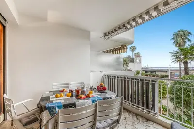 a balcony with a table with fruit on it at Cannes Sea View - Port du Moure Rouge - Happy Rentals in Cannes