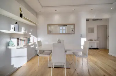 a white dining room with a white table and chairs at Clod - 2 bedrooms - Parking - Wifi Air conditioning in Cannes