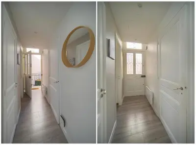 a hallway with a mirror on the wall and a hallway with a door at Lumineux 2 Chambres-BALCON-Stanislas Chic A2B264 in Cannes