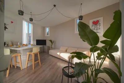 a living room with a couch and a table at Lumineux 2 Chambres-BALCON-Stanislas Chic A2B264 in Cannes