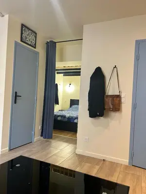 a bedroom with a bed with two bags on it at Cannes Suquet Studio in Cannes