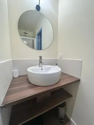 a bathroom with a white sink and a mirror at Cannes Suquet Studio in Cannes