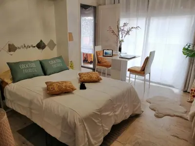 a bedroom with a large bed with two pillows on it at Yes I Cannes in Cannes