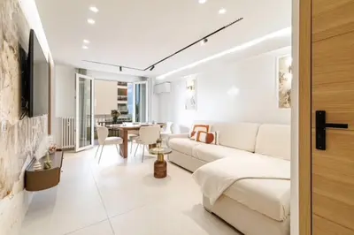 a living room with a couch and a table at Modern apartment in Cannes 6 people in Cannes