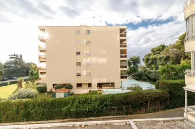an apartment building with a pool in front of it at Modern apartment in Cannes 6 people in Cannes