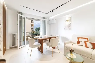 a living room with a table and a couch at Modern apartment in Cannes 6 people in Cannes