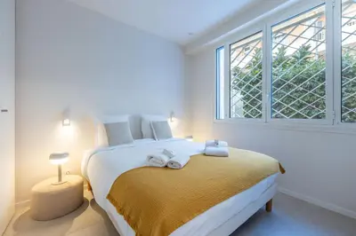 a bedroom with a large bed with towels on it at Modern 2 Chambres-TERRASSE-POINTE CROISTTE-PALM BEACH A2B267 in Cannes