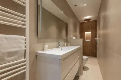 a bathroom with a white sink and a toilet at Modern 2 Chambres-TERRASSE-POINTE CROISTTE-PALM BEACH A2B267 in Cannes
