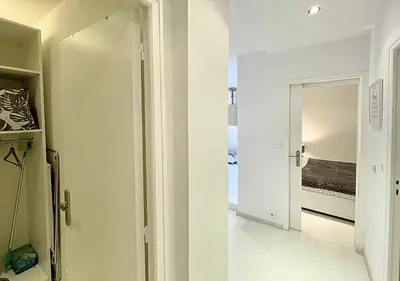 a hallway with a door leading to a bedroom at Viva Riviera Cocoon Apartment Cannes Centre in Cannes
