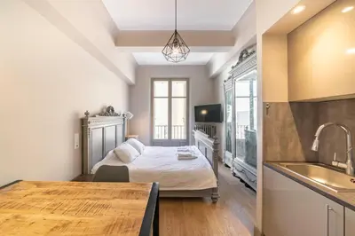 a bedroom with a bed and a sink at COZYSTAY - 1124 - 3-Bedroom Apartment in the Heart of Cannes with Terrace in Cannes