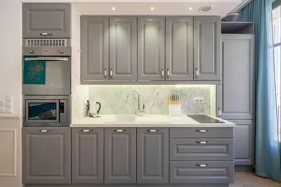a kitchen with gray cabinets and a sink at COZYSTAY - 1124 - 3-Bedroom Apartment in the Heart of Cannes with Terrace in Cannes