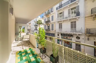 a balcony with a view of a building at Chic appartement 2 pièces in Cannes