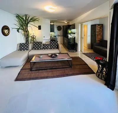 a living room with a couch and a coffee table at Residence Carlton Riviera in Cannes