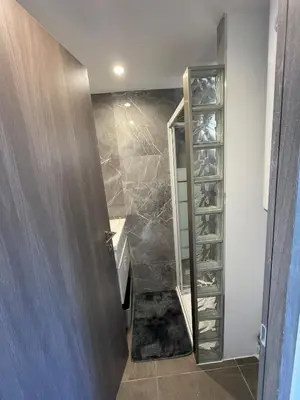 a hallway with a glass door and a walk in closet at Cozy 2-bedroom apartment - Close to Palais, Croisette in Cannes