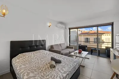 a bedroom with a bed and a living room at Cannes Croisette - 2035 Studio For rent in Cannes