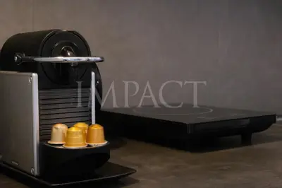 a black sewing machine sitting on a table at Cannes Croisette - 2035 Studio For rent in Cannes
