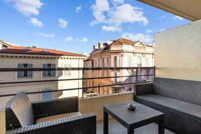 a balcony with two chairs and a table on a balcony at Cannes Croisette - 2035 Studio For rent in Cannes