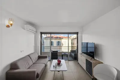 a living room with a couch and a table at Cannes Croisette - 2035 Studio For rent in Cannes
