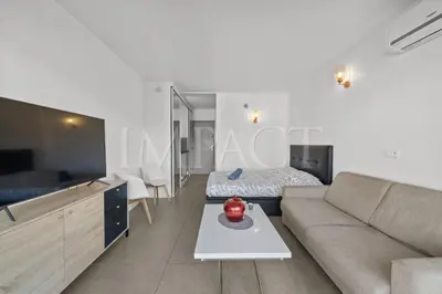 a living room with a couch and a bed at Cannes Croisette - 2035 Studio For rent in Cannes