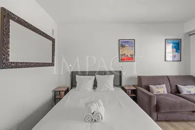 a bedroom with a bed and a couch at Cannes Croisette 2034 - Studio for rent in Cannes