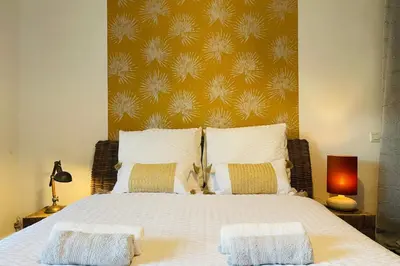 a bedroom with a large bed with two pillows at Bright apartment in Cannes for 5 people in Cannes