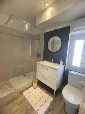 a bathroom with a toilet and a sink and a shower at Bright apartment in Cannes for 5 people in Cannes