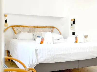 a bedroom with a white bed with two white pillows at Nova - near sea and beaches in Cannes