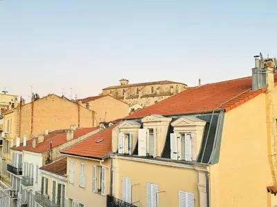 a group of buildings in a city with a castle at Le Clemenceau - Cannes Mer Belle Vue in Cannes