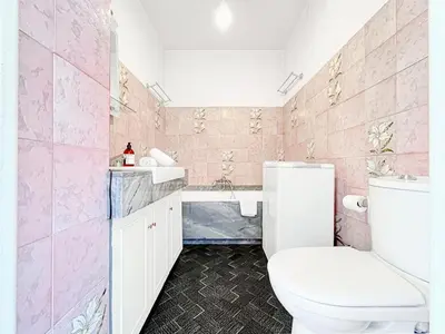 a pink bathroom with a toilet and a sink at Cannes Montfleury - Comfortable accommodation Center in Cannes