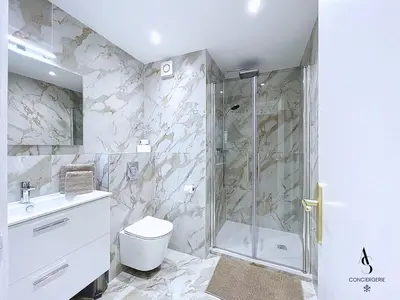 a bathroom with a shower and a toilet and a sink at Le Gatsby - 2 pers - 10 min Palais - AC in Cannes