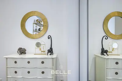 a white dresser with a mirror on top of it at Le Mimosa in Cannes
