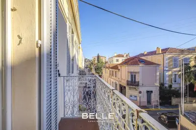 a balcony with a view of a city at Le Mimosa in Cannes