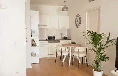 a kitchen counter with a coffee maker and a television at Casa Dolce Cannes in Cannes